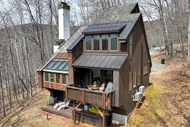78 Coopers Trce, Plymouth, VT 05056 - back of property with a chimney, a standing seam roof, and metal roof