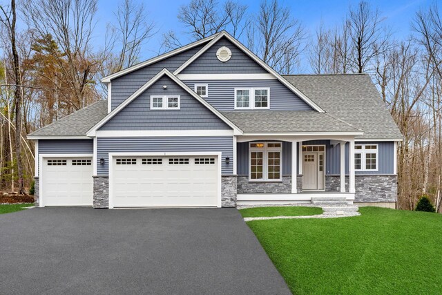 3 Sundance Ln Lot N - The Hanh, Lot N The Hanh, Bow, NH 03304 - craftsman house featuring stone siding, a shingled roof, and a garage