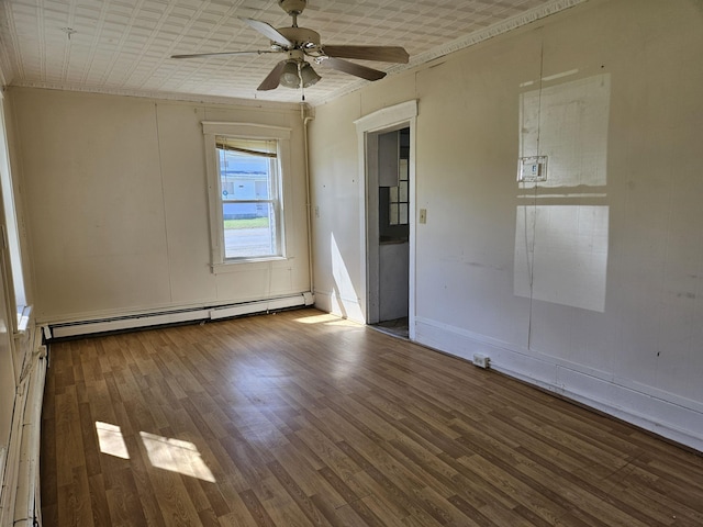 unfurnished room with baseboard heating, ceiling fan, baseboards, and wood finished floors