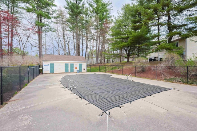 view of pool featuring fence
