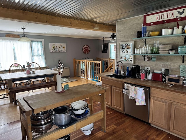 kitchen featuring dark wood finished floors, ceiling fan, dishwasher, a sink, and beam ceiling