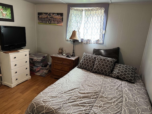 bedroom featuring wood finished floors