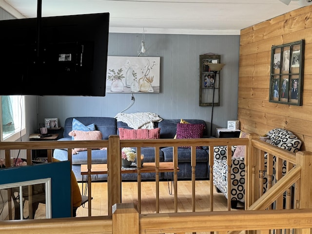 living area featuring wood walls
