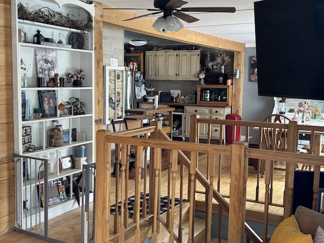 interior space with wood finished floors and ceiling fan