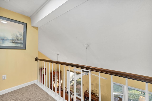corridor featuring carpet and baseboards