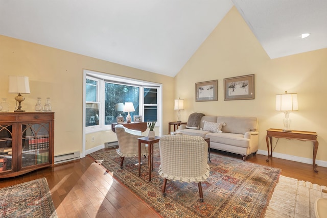 living room with hardwood / wood-style floors, baseboards, and a baseboard heating unit