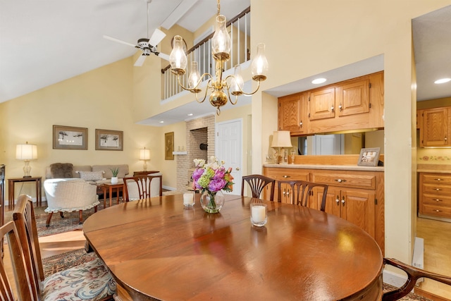 dining area featuring a chandelier, high vaulted ceiling, and beamed ceiling