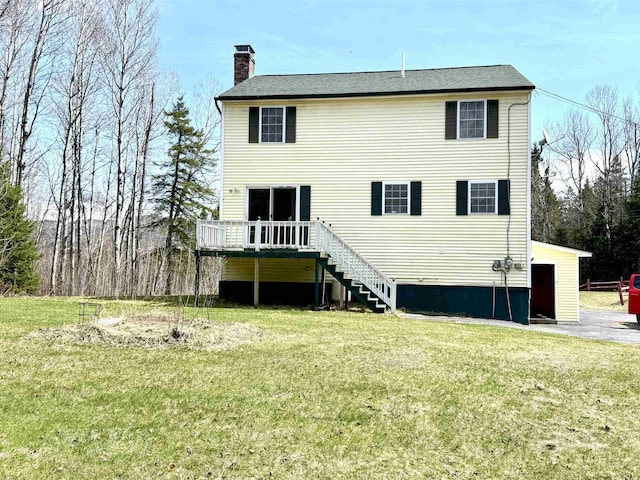 207 Blakely Farm Rd, Colebrook, NH 03576 - back of house featuring a lawn, a wooden deck, stairs, and a chimney