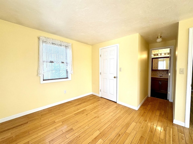 207 Blakely Farm Rd, Colebrook, NH 03576 - spare room featuring baseboards, a textured ceiling, and light wood-style flooring