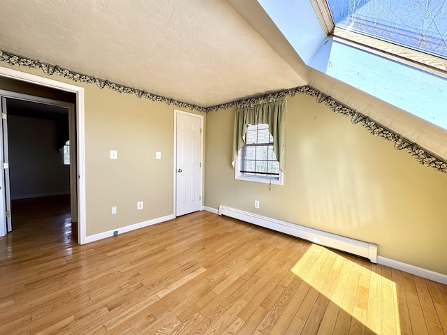 207 Blakely Farm Rd, Colebrook, NH 03576 - interior space with light wood-style floors, baseboard heating, and baseboards