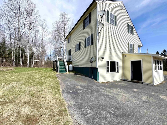 207 Blakely Farm Rd, Colebrook, NH 03576 - view of property exterior with a lawn and stairway