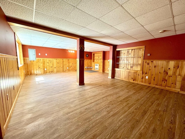207 Blakely Farm Rd, Colebrook, NH 03576 - finished below grade area featuring baseboards, wooden walls, a drop ceiling, wood finished floors, and wainscoting