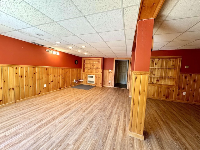 207 Blakely Farm Rd, Colebrook, NH 03576 - finished basement featuring a paneled ceiling, wainscoting, and wood finished floors