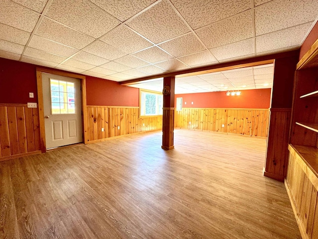 207 Blakely Farm Rd, Colebrook, NH 03576 - basement with wood walls, wood finished floors, a paneled ceiling, and wainscoting