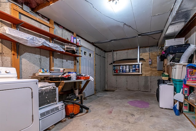 below grade area with a workshop area and washer / dryer