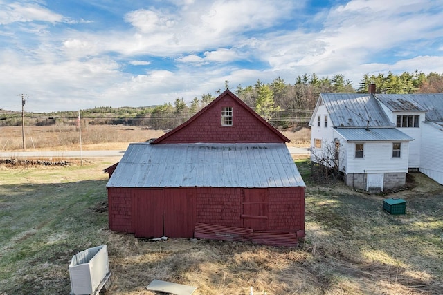 view of barn featuring a lawn