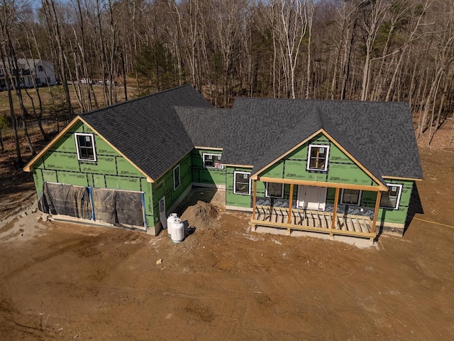 view of front of house with roof with shingles