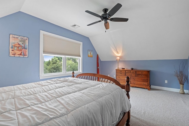 bedroom featuring baseboards, visible vents, carpet flooring, and vaulted ceiling