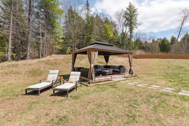 view of yard featuring outdoor lounge area and a gazebo
