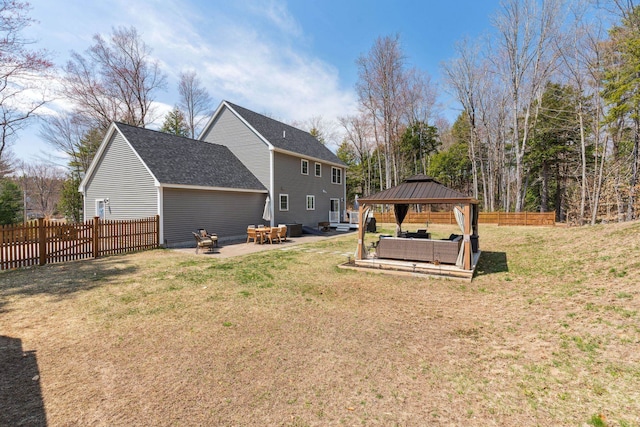 view of yard featuring an outdoor living space, fence, a gazebo, and a patio area