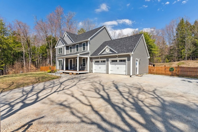view of front facade featuring driveway, a shingled roof, an attached garage, fence, and a porch