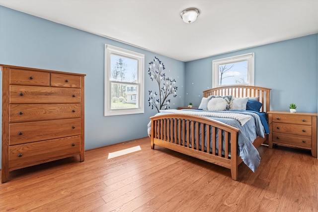 bedroom with light wood-style floors