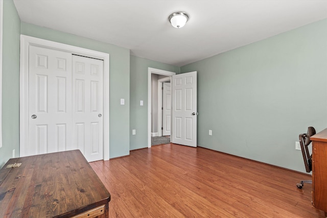 unfurnished office with light wood-style floors