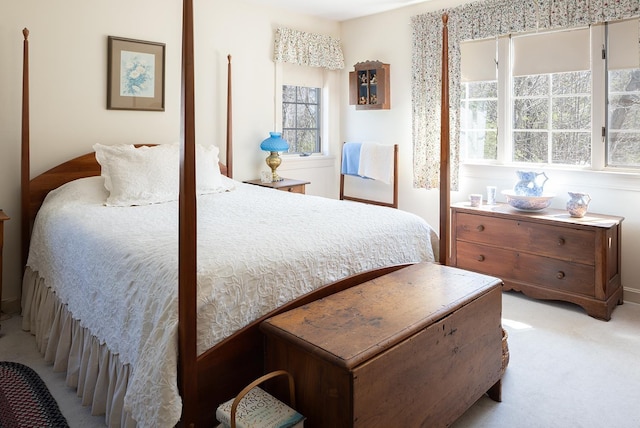 bedroom featuring light colored carpet