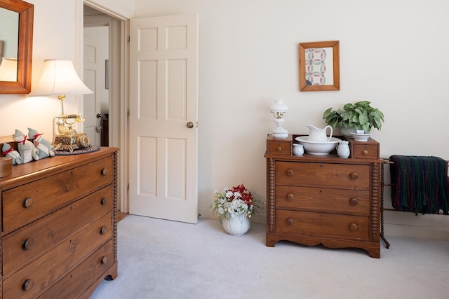 bedroom with light colored carpet