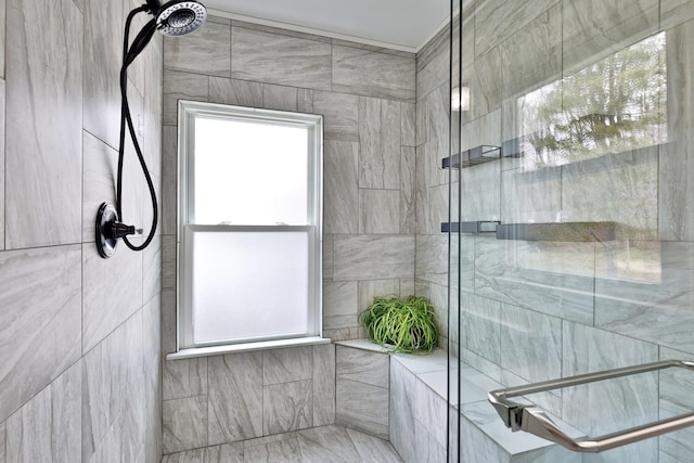bathroom with a tile shower