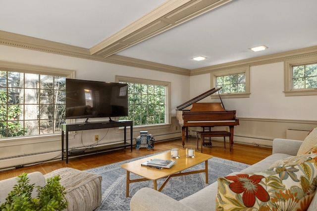 living area with ornamental molding, wood finished floors, and a baseboard radiator