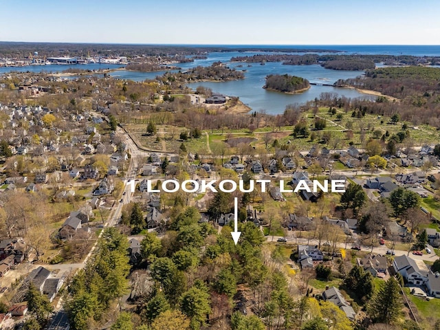 bird's eye view with a water view and a residential view