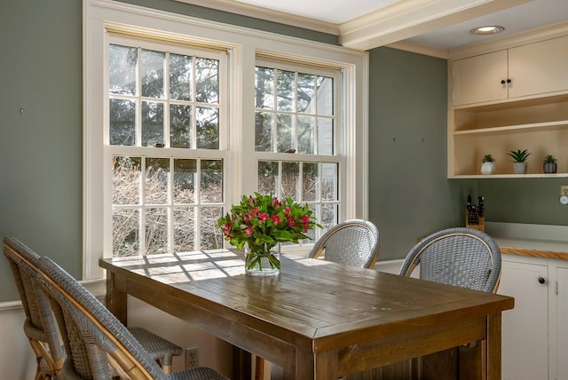 dining space featuring ornamental molding