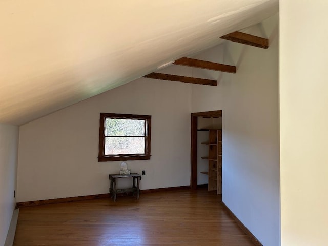 bonus room featuring wood finished floors, lofted ceiling, and baseboards