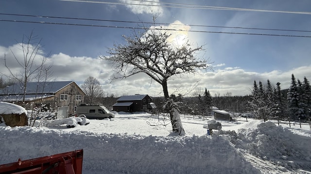 view of yard layered in snow