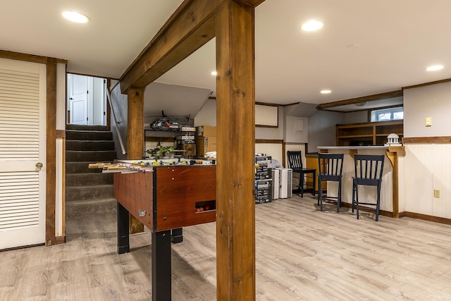 recreation room with baseboards, recessed lighting, and wood finished floors
