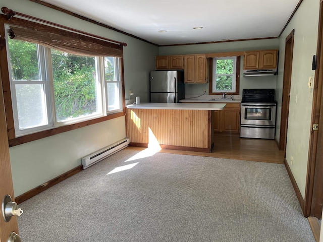 kitchen featuring stainless steel appliances, a baseboard heating unit, under cabinet range hood, light countertops, and a sink