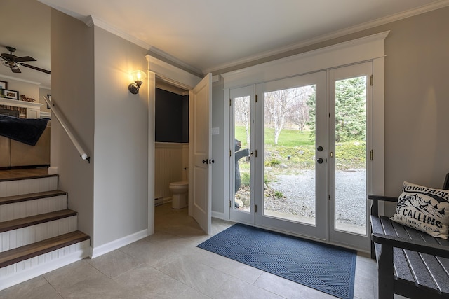 doorway to outside featuring light tile patterned floors, crown molding, stairway, ceiling fan, and baseboards