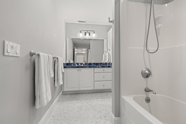full bath with tub / shower combination, visible vents, vanity, and baseboards