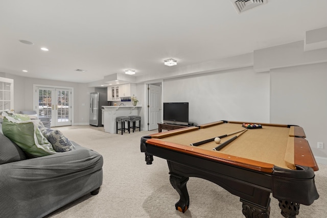 game room with billiards, visible vents, light carpet, and french doors