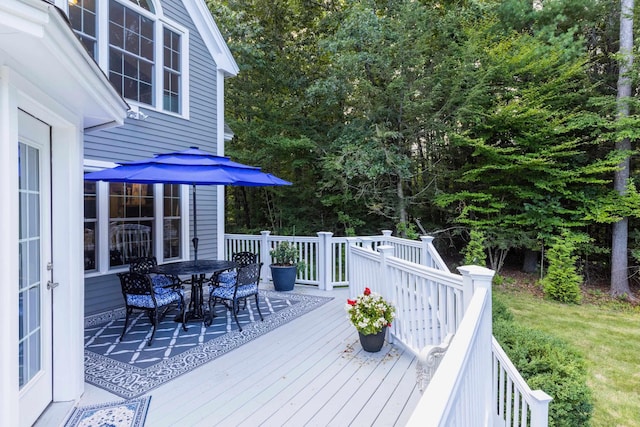 deck with outdoor dining area