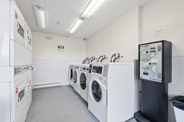 common laundry area with stacked washing maching and dryer, a baseboard radiator, separate washer and dryer, and a wainscoted wall