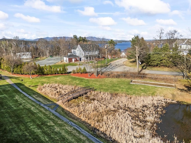 exterior space with a water and mountain view