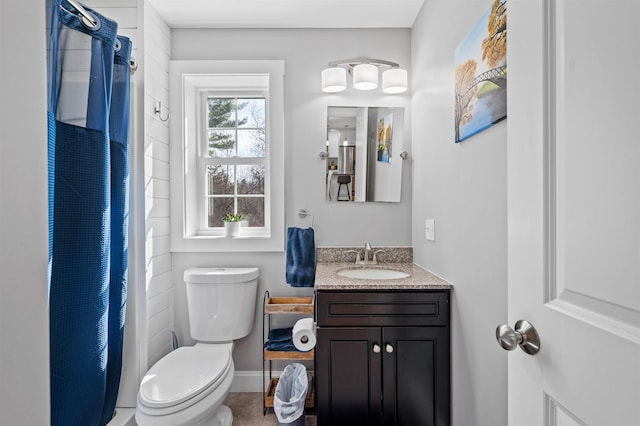 bathroom featuring toilet, a shower with curtain, and vanity
