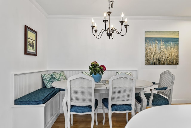 46A River St Unit A, Seabrook, NH 03874 - dining space with an inviting chandelier, wood finished floors, ornamental molding, and wainscoting