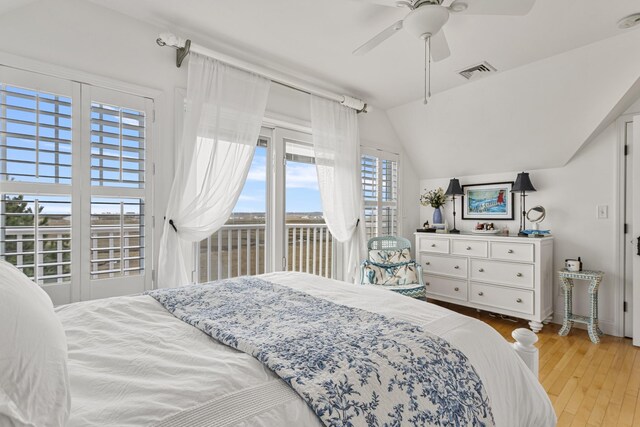 46A River St Unit A, Seabrook, NH 03874 - bedroom featuring visible vents, ceiling fan, light wood-style floors, access to exterior, and vaulted ceiling
