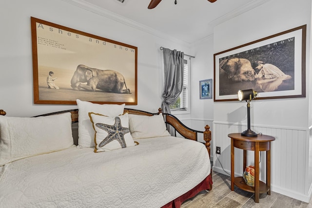 46A River St Unit A, Seabrook, NH 03874 - bedroom with ornamental molding, a wainscoted wall, ceiling fan, and wood finished floors