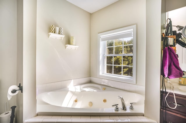 bathroom featuring a tub with jets