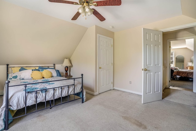 carpeted bedroom with baseboards and a ceiling fan
