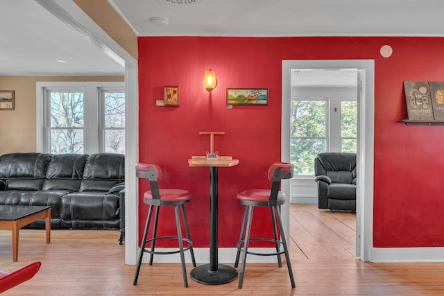 interior space with hardwood / wood-style floors and baseboards